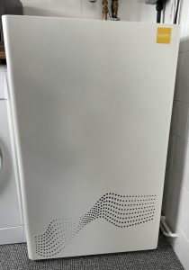 Photo (face on) of the ZEB heat battery boiler installed in a home.