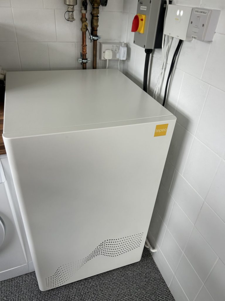 Photo (taken from above) of the ZEB heat battery boiler installed in a home.