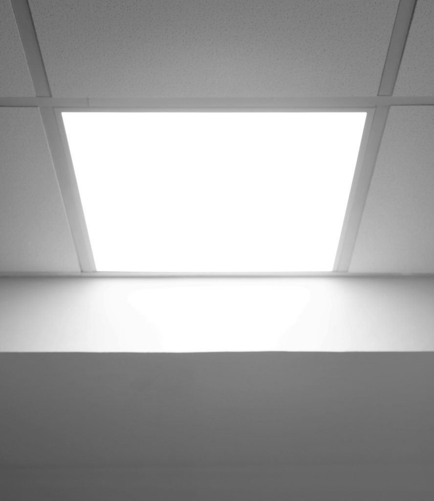 Photograph of LED panel light fitted in a ceiling.